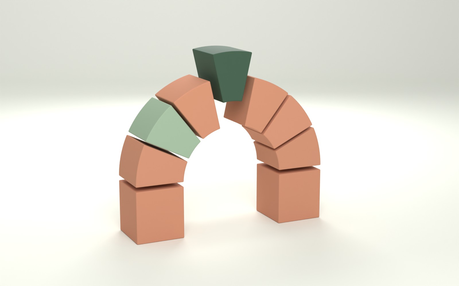 An arch of clay-colored blocks with one sage block and a dark green keystone going in at the top